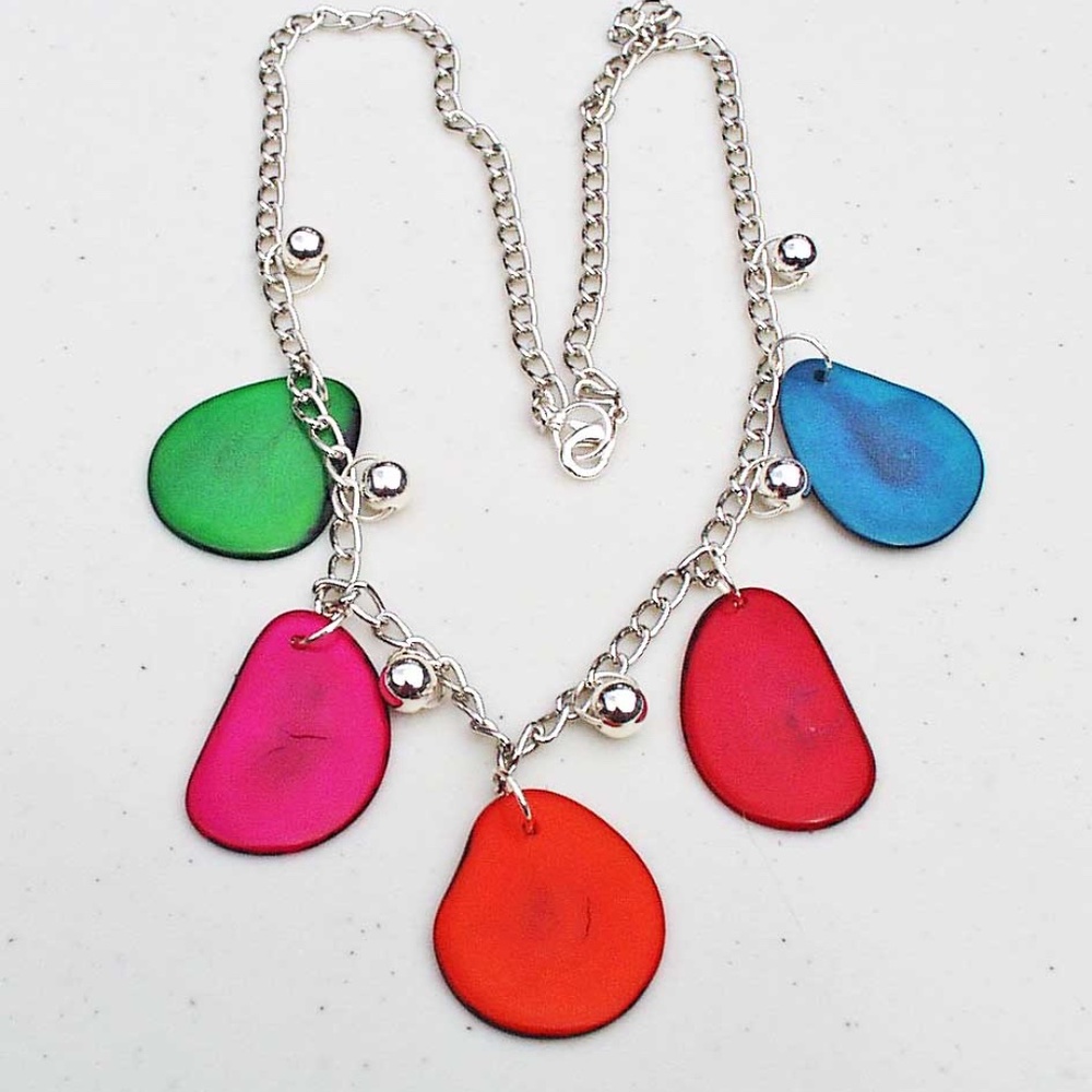 TAGUA NUT SLICE NECKLACE, 22 INCHES LONG, SLICES IN BRIGHT COLOURS BOTH SIDES,